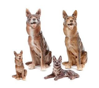 * A Group of Four Porcelain German Shepherds Height of tallest 8 3/4 inches.