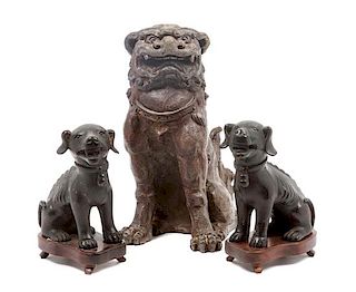 * A Group of Three Chinese Foo Dogs Height of tallest 12 inches.