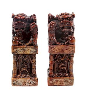 * A Pair of Chinese Foo Dog Soapstone Stamp Sealers Height 8 inches.