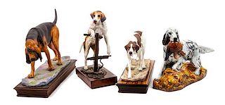 * A Group of Four Dog Figures of Various Breed Width of widest 14 1/2 inches.