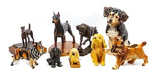 * A Group of Nine Dog Figures of Various Breed Height of tallest 13 1/2 inches.