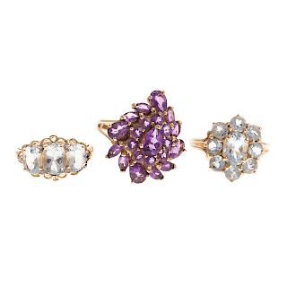 A Trio of Gemstone Cluster Rings in Gold