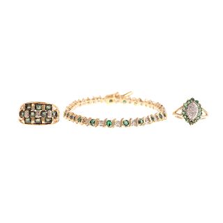 An Emerald & Diamond Bracelet & Two Rings in Gold