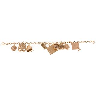 A Ladies 14K Gold Charm Bracelet