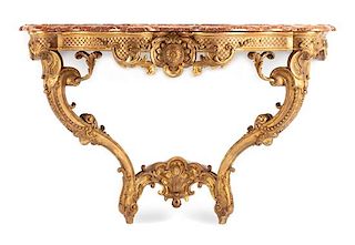 A Regence Style Carved Giltwood Console Height 32 x width 51 x depth 21 1/2 inches.