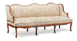 A French Provincial Walnut Sofa Height 37 x width 82 x depth 32 inches.