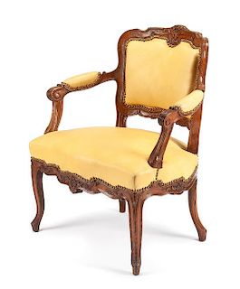 A French Provincial Oak Fauteuil Height 33 3/4 inches.