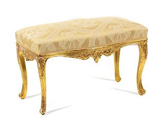 A Louis XV Style Giltwood Bench Height 19 x width 32 x depth 19 inches.