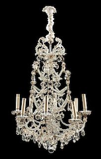 A Louis XV Style Silvered Eight-Light Chandelier Height 47 x diameter 28 inches.
