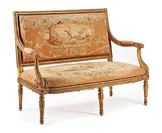 A Louis XVI Style Giltwood Settee Height 40 x width 54 x depth 24 inches.