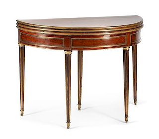 A Louis XVI Gilt Metal Mounted Mahogany Flip-Top Table Height 31 x width 43 1/2 x depth 21 inches.