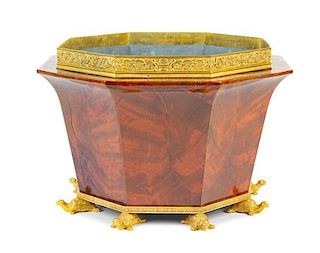 An Empire Style Gilt Bronze Mounted Mahogany Jardiniere Height 13 x width 19 3/4 inches.