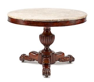 A Charles X Mahogany Center Table Height 27 x diameter of top 38 inches.