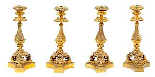 Four French Gilt Bronze Candlesticks Height 11 5/8 inches.