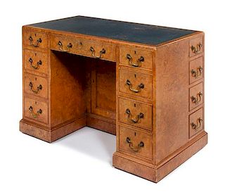 A Continental Burlwood Kneehole Desk Height 30 x width 43 1/2 x depth 23 inches.