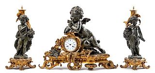 A Large French Gilt and Patinated Bronze Clock Garniture Height of mantel clock 24 x width 31 inches.