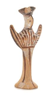 * A Mycenaean Terra Cotta Psi Figure Height 4 1/8 inches.