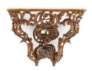 A Venetian Mirror-Inset Giltwood Console Table Height 34 x width 44 x depth 16 1/2 inches.