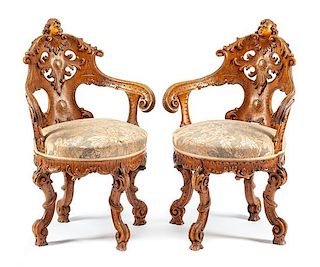 A Pair of Venetian Carved Armchairs Height 36 inches.
