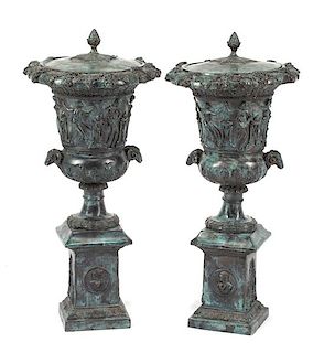 A Pair of Pompeiian Style Patinated Bronze Covered Urns Height 31 1/2 inches.