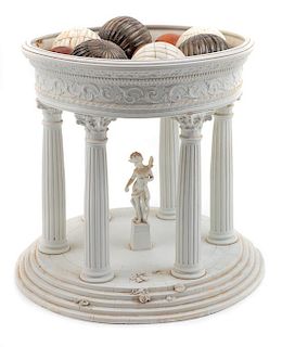 A Grand Tour Style Bisque Architectural Model with a Collection of Bone and Marble Ornaments Height of model 12 5/8 inches.