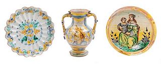 An Italian Majolica Handled Vase and Two Plates Height of vase 10 1/2 inches; diameter of larger plate 11 1/4 inches.