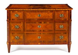 An Italian Satinwood and Parquetry Commode Height 32 3/4 x width 49 1/8 x depth 24 3/4 inches.