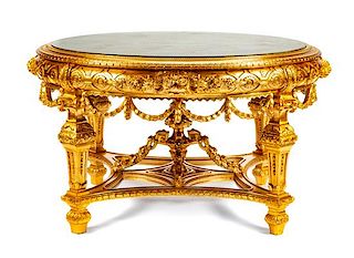An Italian Louis XVI Style Giltwood Salon Table Height 32 x diameter of top 57 inches.
