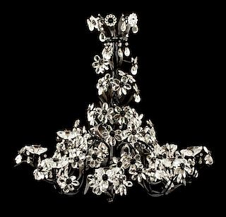 An Italian Iron, Tole and Glass Eight-Light Chandelier Height 31 x diameter 34 inches.