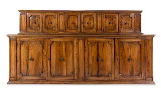 An Italian Baroque Walnut Cabinet Height 63 3/4 x width 125 3/4 x depth 25 inches.