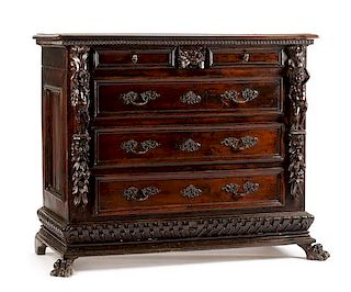 An Italian Renaissance Style Carved Chest of Drawers Height 46 x width 53 1/2 x depth 25 3/8 inches.