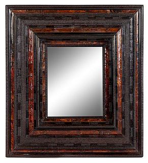 A Flemish Ripple Molded and Tortoise Shell Veneered Mirror Height 48 x width 43 5/8 inches.