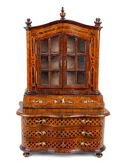 A Diminutive German Walnut and Marquetry Secretary Bookcase Height 23 3/8 x width 16 1/8 x depth 7 1/4 inches.