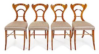 A Set of Four Biedermeier Marquetry Chairs Height 35 inches.
