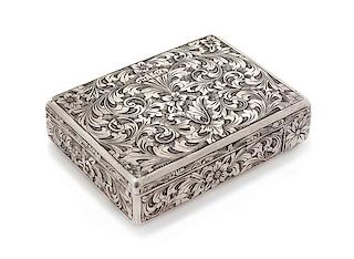 * An Italian Silver Compact, First Half 20th Century, the case worked to show floral and foliate scroll decoration, opening to a