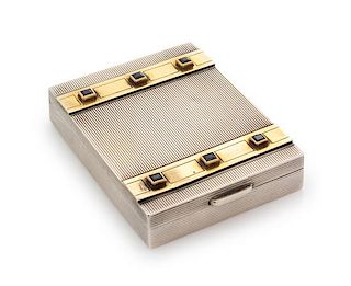 * A French Silver, 14-Karat Gold and Sapphire Inset Compact, Cartier, Paris, First Half 20th Century, the case with reeded decor