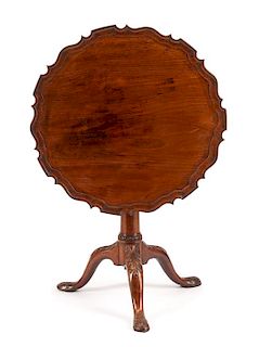 A George II Mahogany Tilt-Top Table Height 28 x diameter of top 29 1/2 inches.