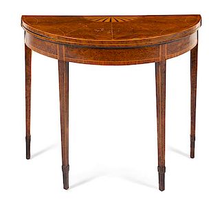 A George III Burl Walnut and Satinwood Marquetry Flip-Top Table Height 27 3/4 x width 34 x depth 17 inches.