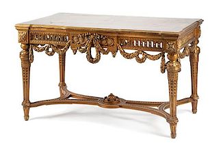 An English Painted and Giltwood Center Table Height 31 x width 54 x depth 30 1/2 inches.