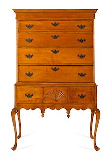 An Queen Anne Style Maple Highboy Height 63 x width 39 x depth 20 1/2 inches.