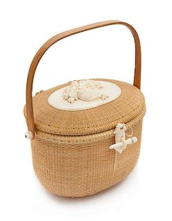 * A Woven Nantucket Basket Height 7 1/4 inches.