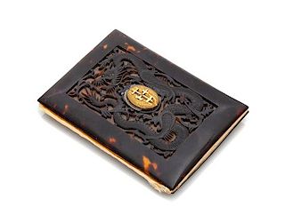* A Japanese Gilt Metal Mounted Carved Tortoise Shell Wallet Width 4 1/8 inches.