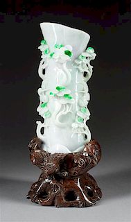 A Chinese Carved Jadeite Vase Height of vase 8 x width 4 inches.