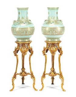 A Pair of Chinese Gilt Decorated Celadon Glazed Porcelain Vases and Gilt Bronze Pedestals Height of porcelain 20 inches; height
