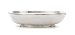 An Italian Silver Bowl, Buccellati, Mid 20th Century, oval, with lightly spot-hammered surface, applied reeded rim and raised on