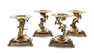A Set of Four French Silver-Gilt Candle Stands, Odiot, Paris, Second Half 19th Century, the stepped circular bases with guilloch