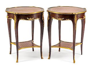 A Pair of Louis XV Style Gilt Bronze Mounted Parquetry Tables Height 28 x diameter of top 23 inches.