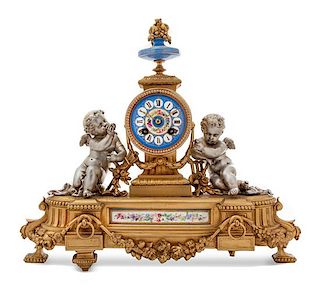 * A French Porcelain Mounted Gilt and Silvered Bronze Mantel Clock Height 14 x width 12 1/2 x depth 3 inches.