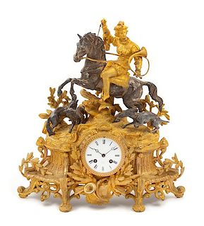 * A French Parcel Gilt Cast Metal Mantel Clock Height 18 1/2 x width 15 1/2 x depth 4 inches.