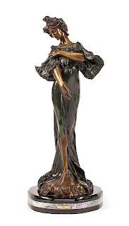 An Art Nouveau Style Patinated Bronze Figure of a Lady Height 27 3/4 inches.